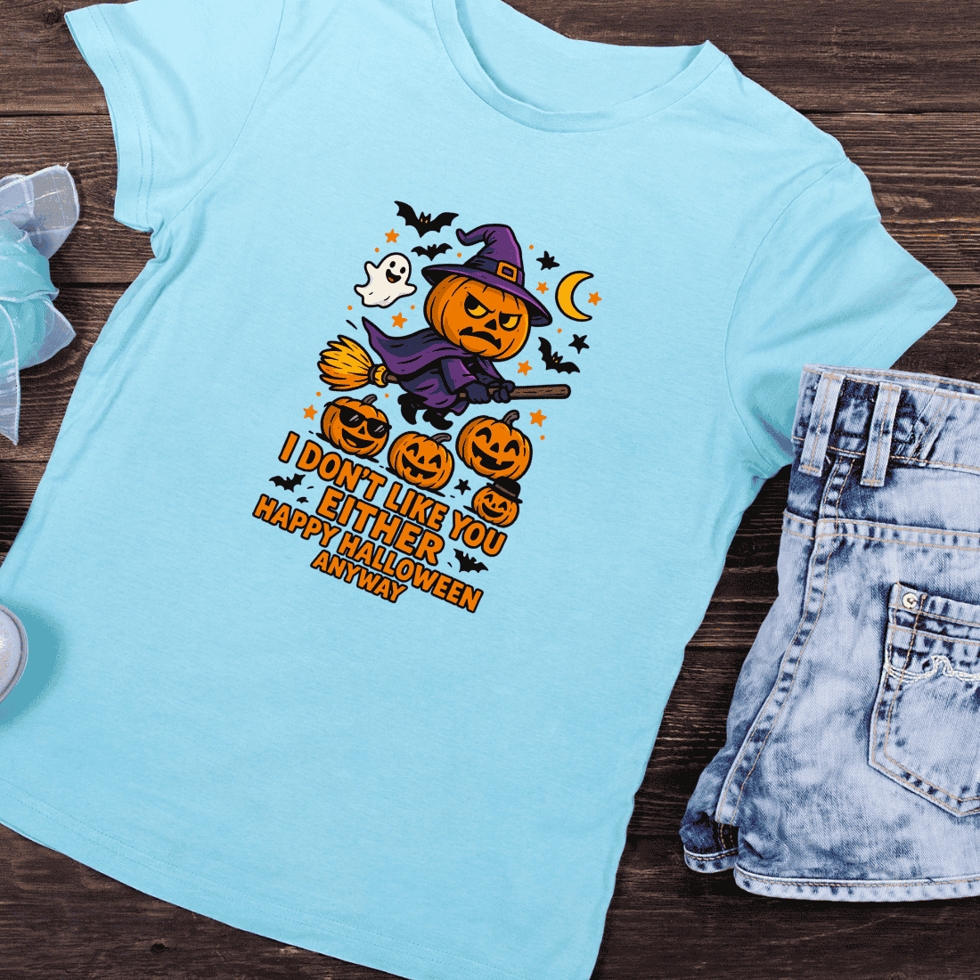 Cartoon Pumpkin Witch on Broom with Quote T-Shirt Design preview image.