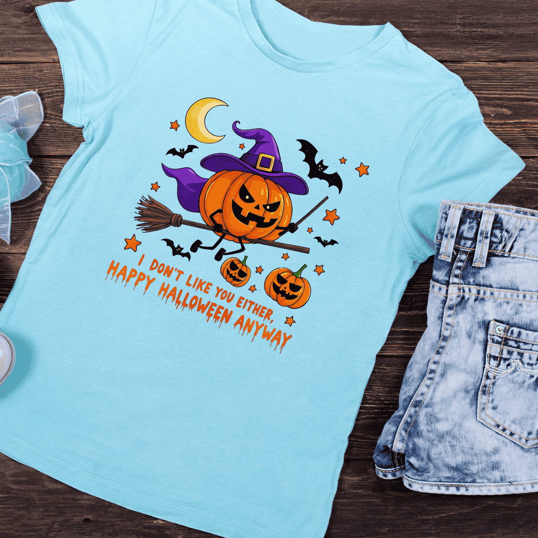 Pumpkin Head Witch Flying on Broomstick T-Shirt Design preview image.