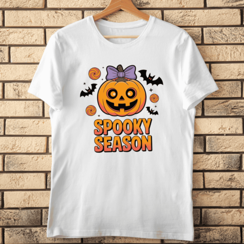 Spooky Season with a Smiling Jack-o'-Lantern and Bats T-shirt Design cover image.