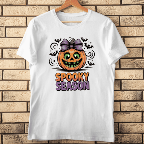 Cute Cartoon Pumpkin with a Bow for Spooky Season T-shirt Design cover image.