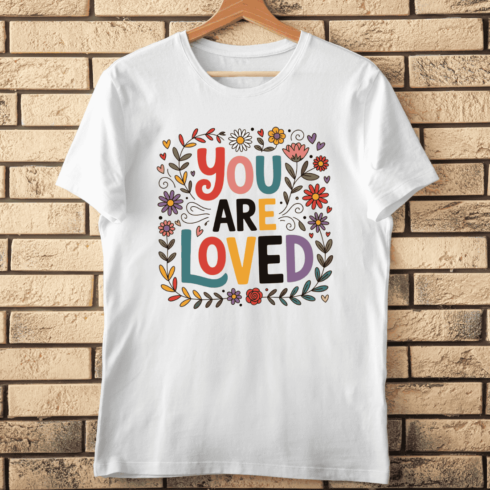Boho Doodle Flower Frame with You Are Loved Text T-Shirt Design cover image.