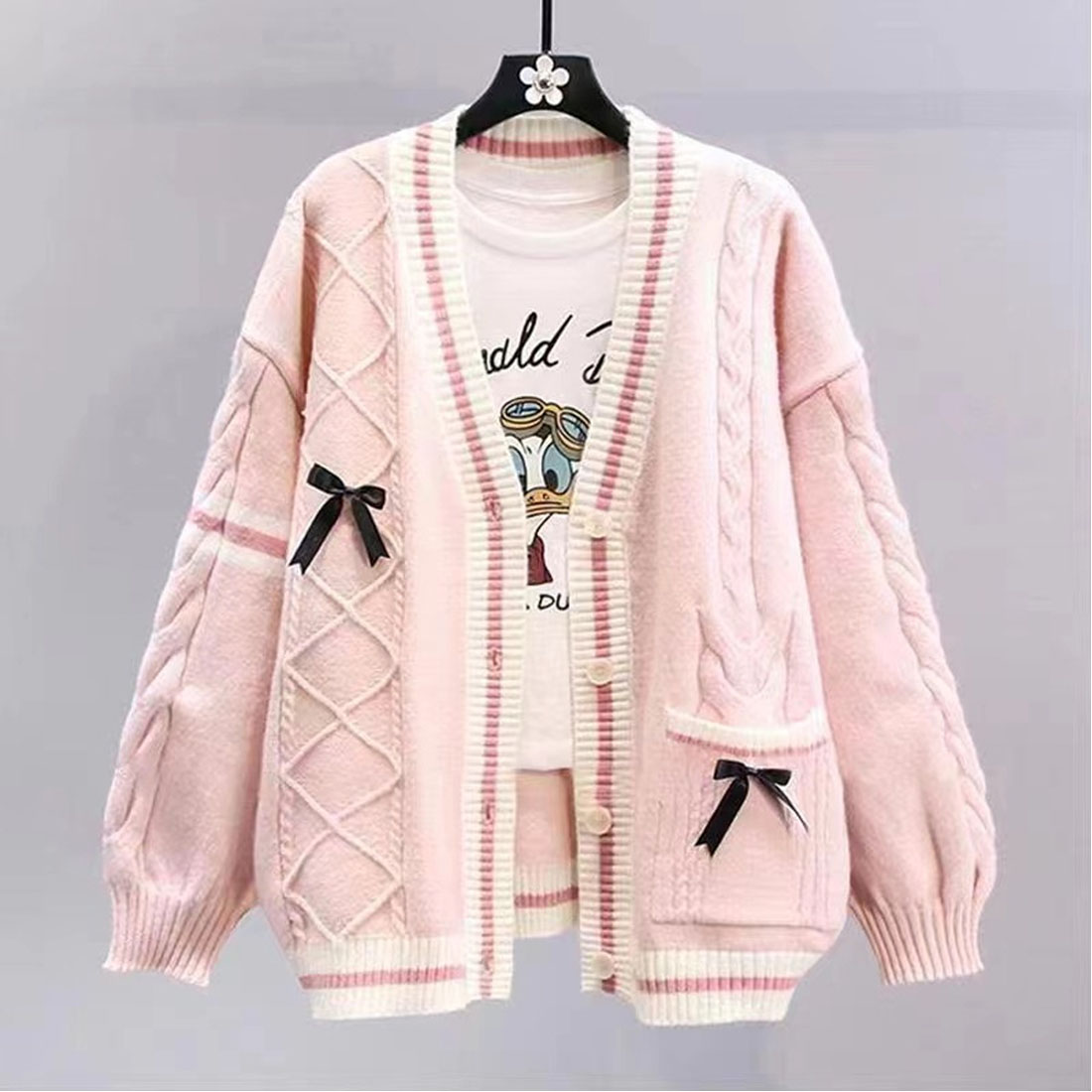 This pink knitted cardigan preview image.