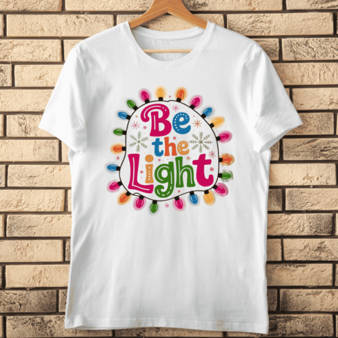 Festive Wreath with Hand-Drawn Typography T-Shirt Design cover image.