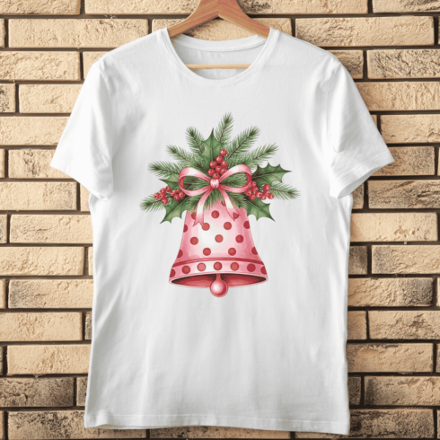 Cute Holiday Bell with Pink Ribbon, Pine, and Berries T-Shirt Design cover image.