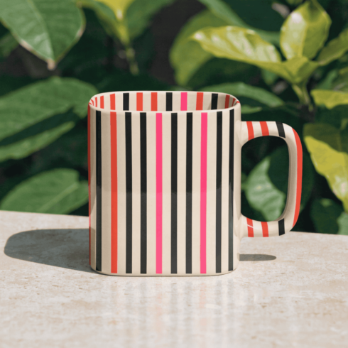 “Vibrant Lines: Shocking Pink, Black & Orange Coffee Mug Pair Mockup” cover image.