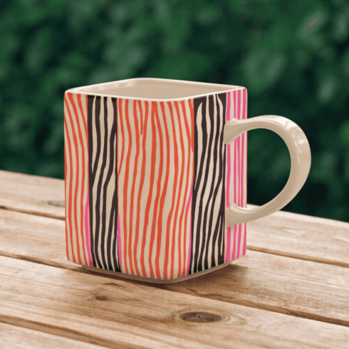 “Vibrant Lines: Shocking Pink, Black & Orange Coffee Mug Pair Mockup” cover image.