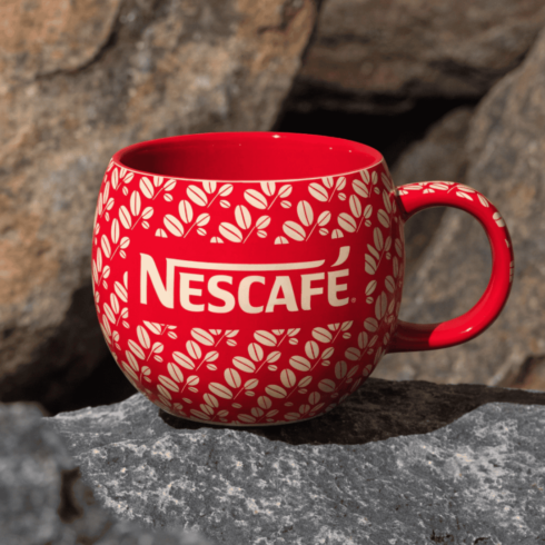 uxury Red Ceramic Mugs Duo Featuring Nescafé Branding cover image.