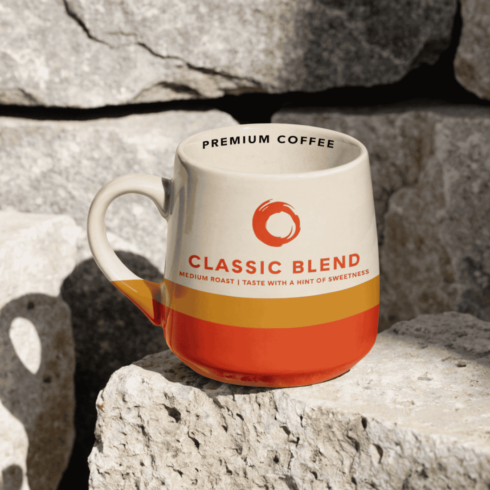 Elegant Coffee Mug Pair with Cream, Orange & Mustard Yellow Nescafé-Inspired Look cover image.