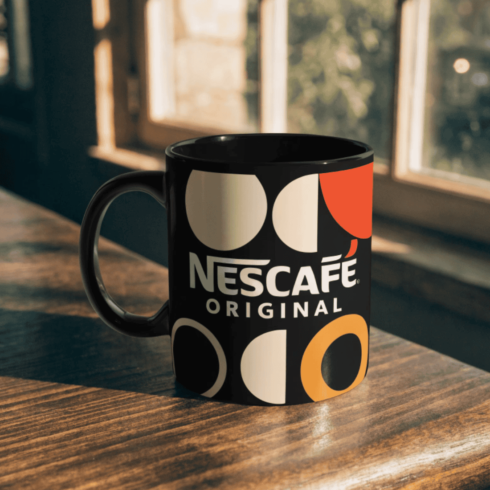 Stylish Black & Cream Coffee Mug Duo Featuring Nescafe Logo and Typography cover image.