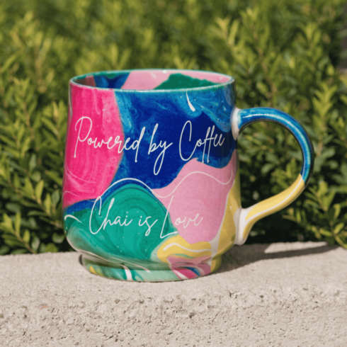 “Powered by Coffee & Chai is Love – Vibrant Multicolor Mug Set with Steam Swirls” cover image.