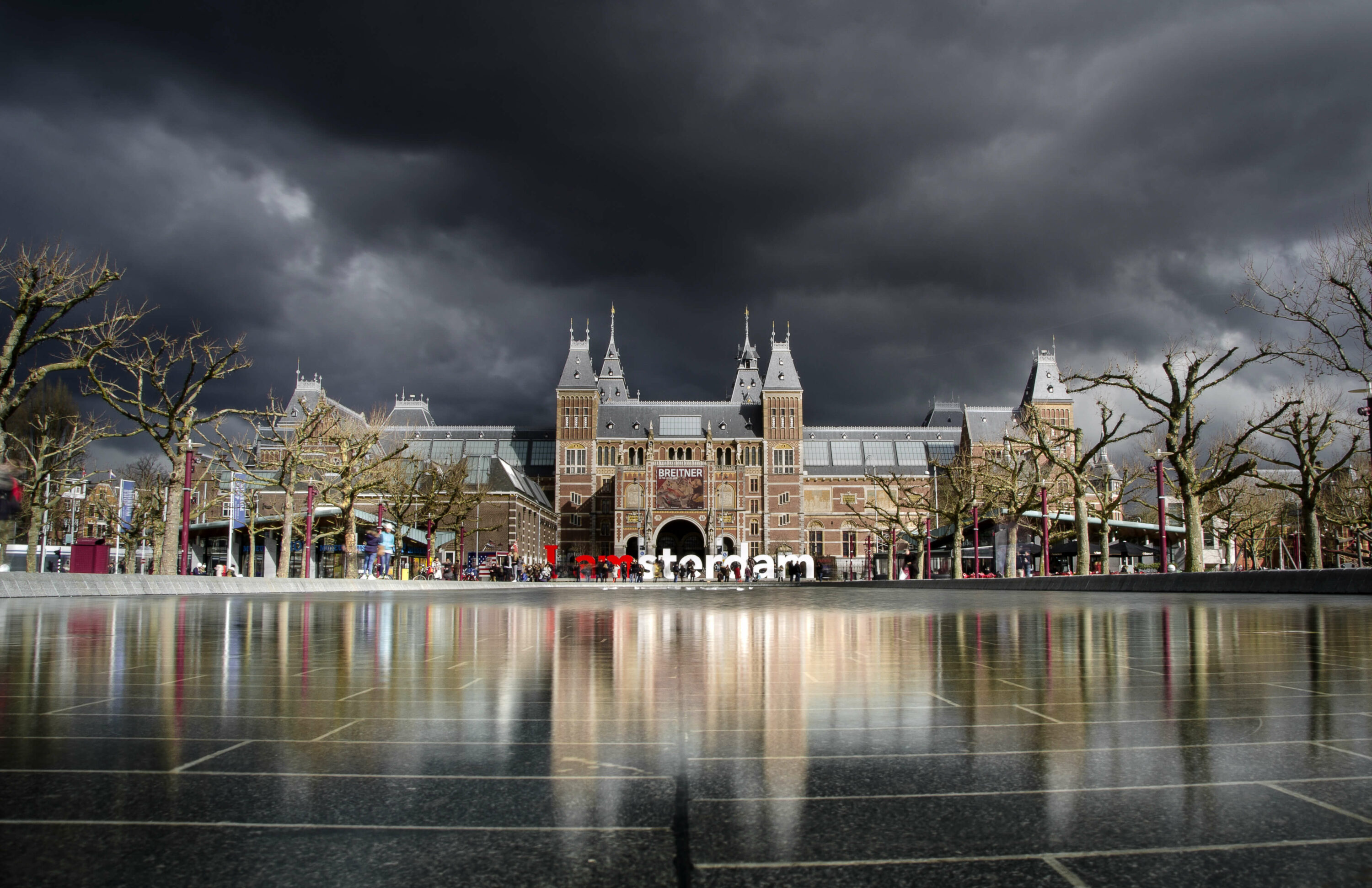 building architecture under dark clouds in amsterdam netherlands