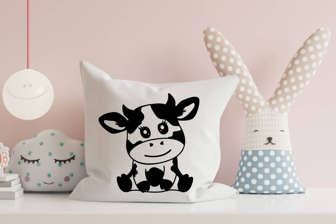 Pillow with a picture of a little cow.