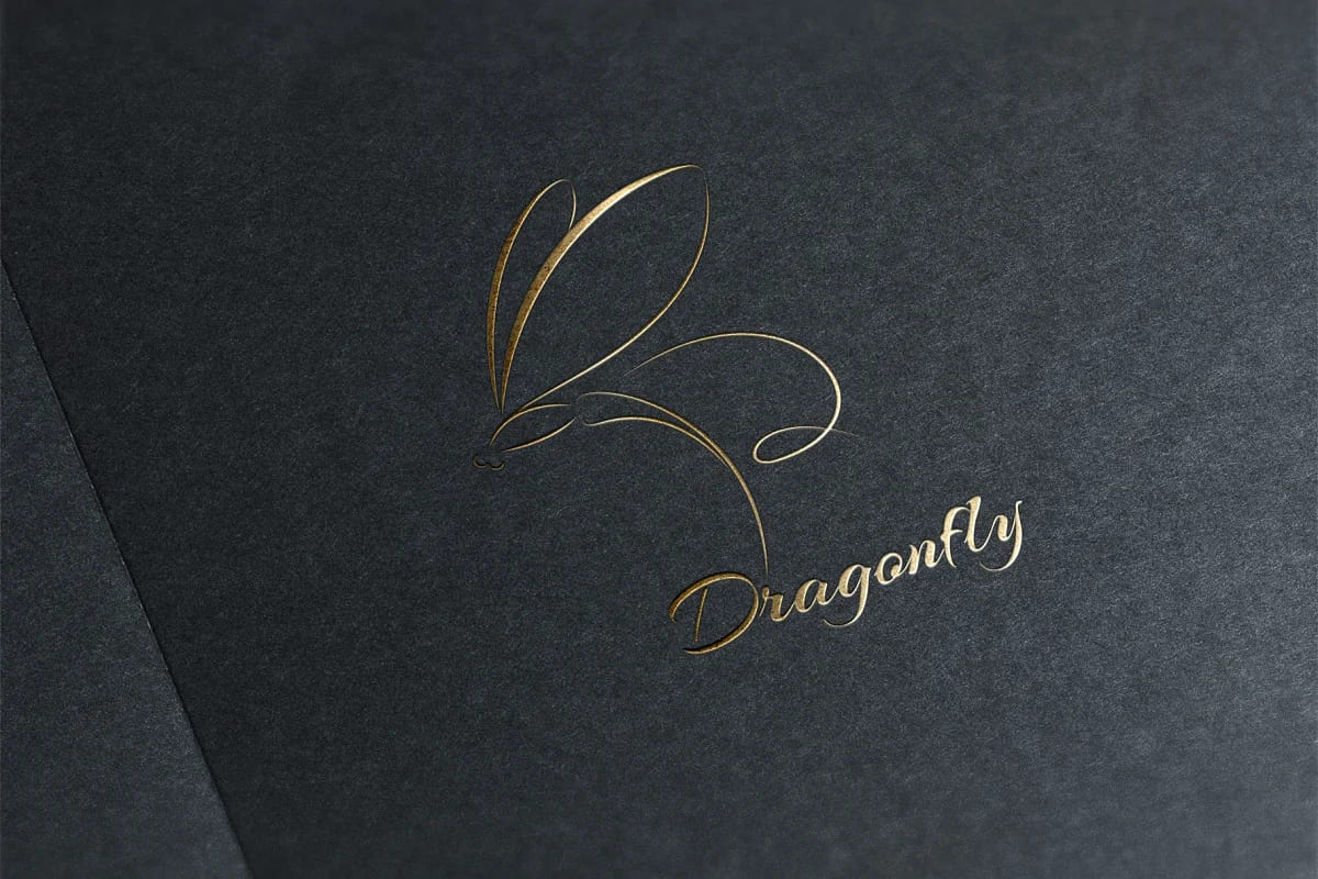 dragonfly golden logo on dark background.