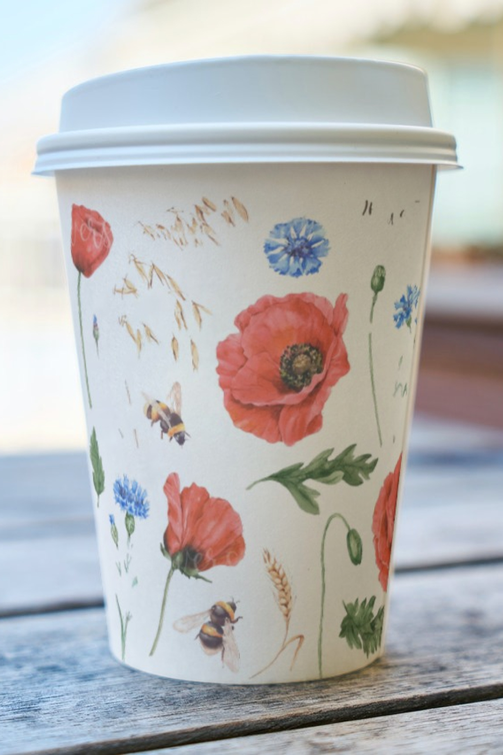 Cup of Coffee with Image with Watercolor Poppies and Bee.
