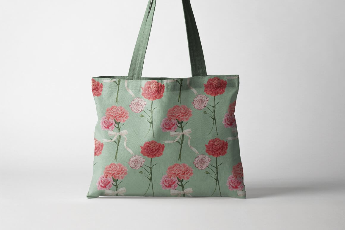 A green bag with red and pink carnations painted on it.