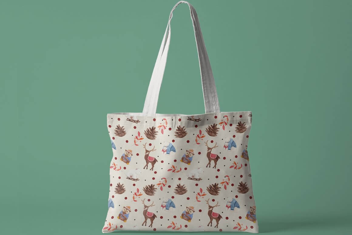White bag with drawings of cones, owls, leaves and deer.