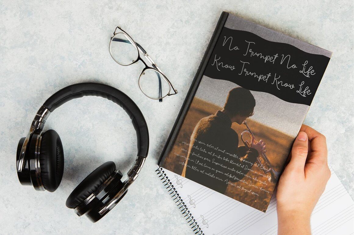 Headphones, glasses, book, notebook.