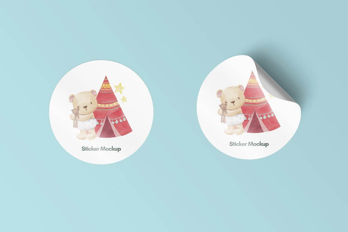 Round white stickers with a picture of a baby bear and tipi.