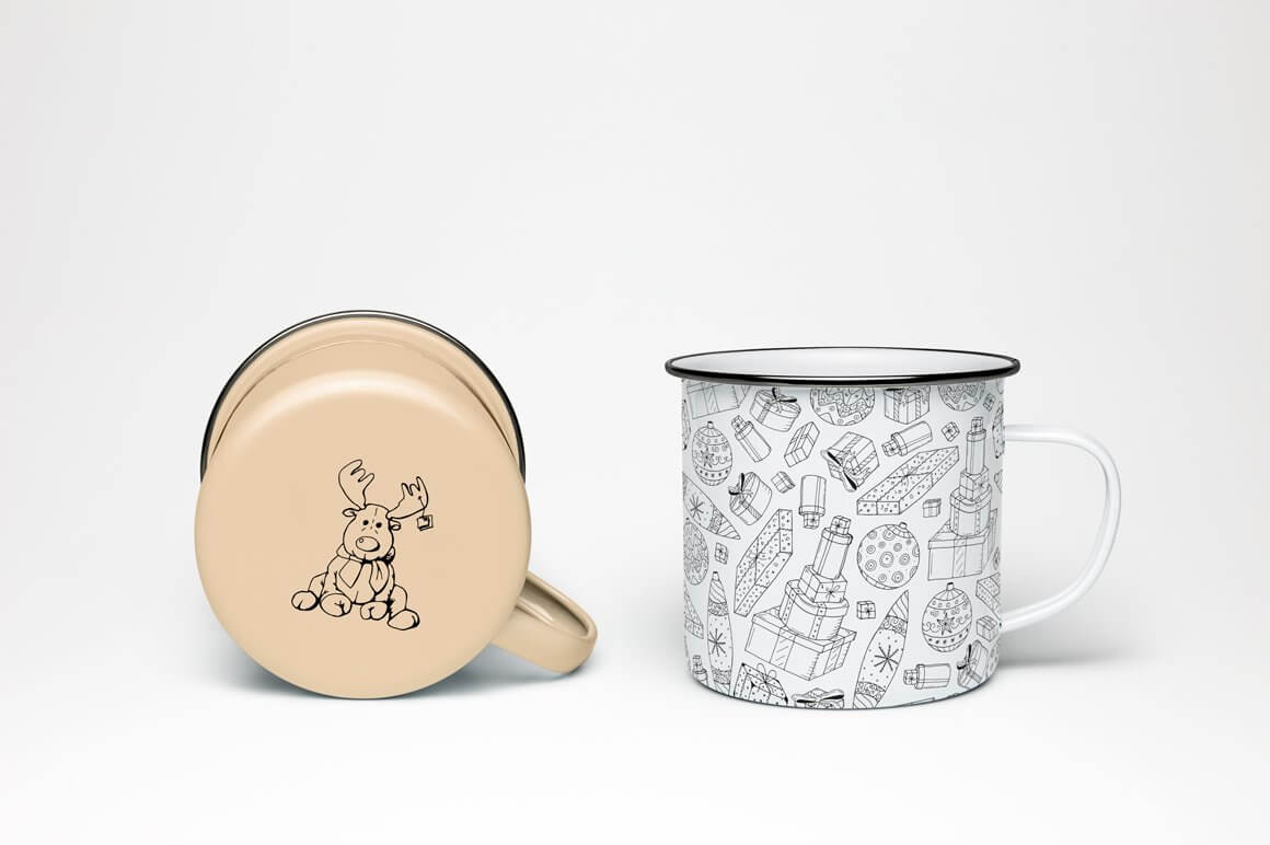Iron cups, one coffee-colored cup with a painted outline of a deer and the other white cup with small drawings of gifts.