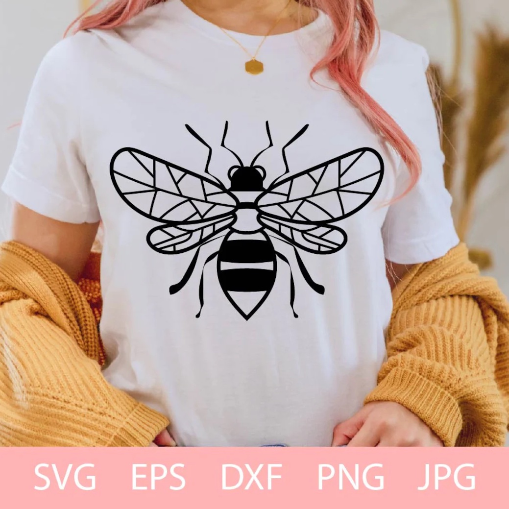Woman wearing a t - shirt with a bee on it.
