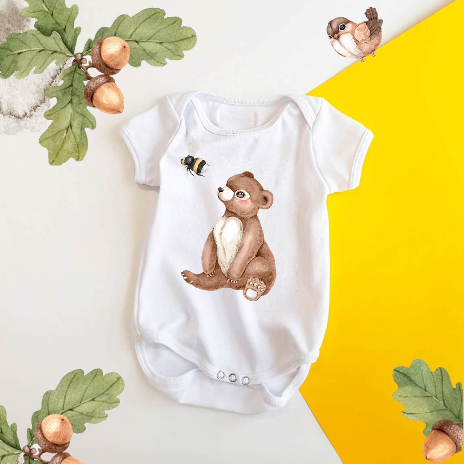 Children's bodysuit with watercolor drawings of a teddy bear and a bee.