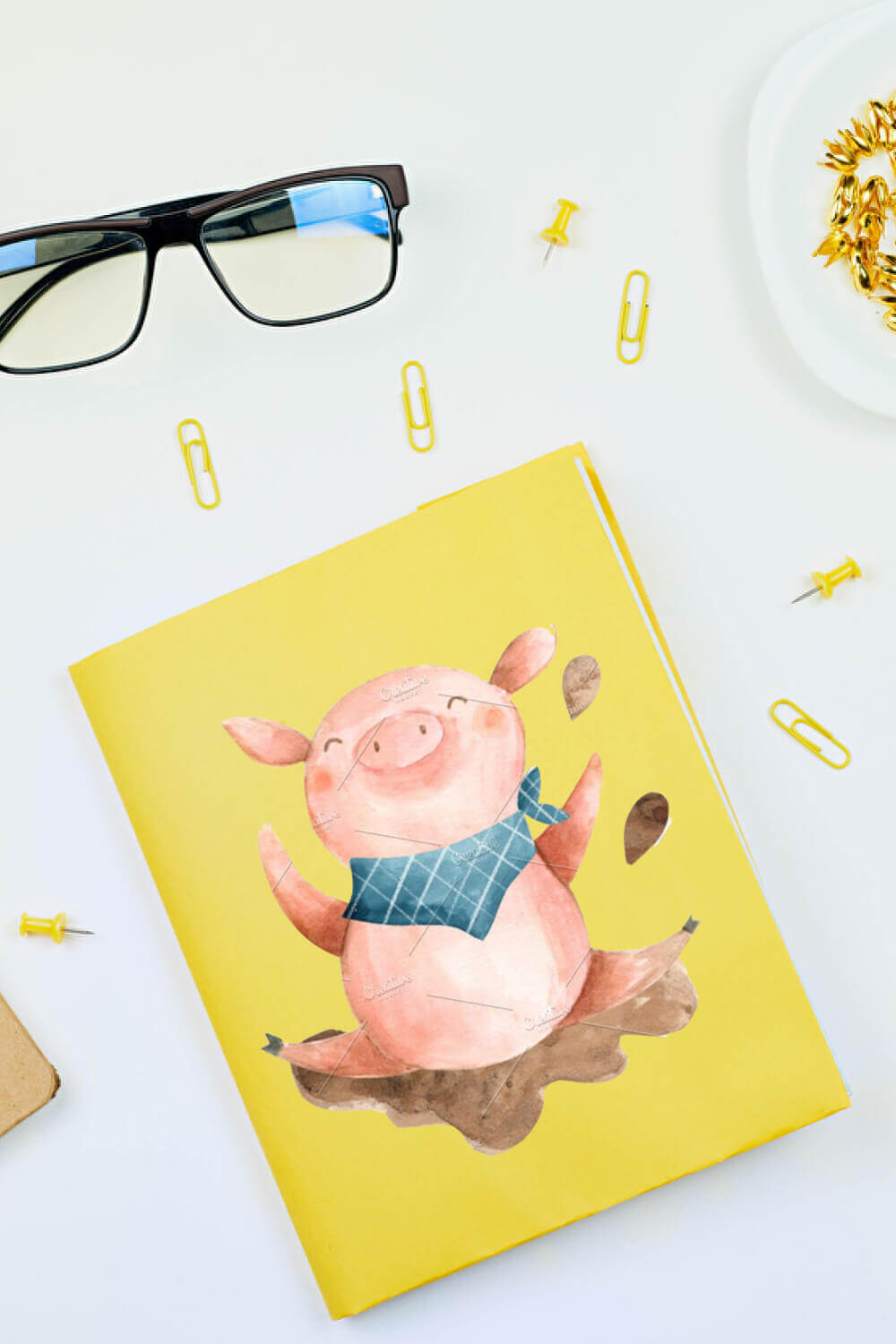 On the yellow card, there is a painted dancing happy pig.
