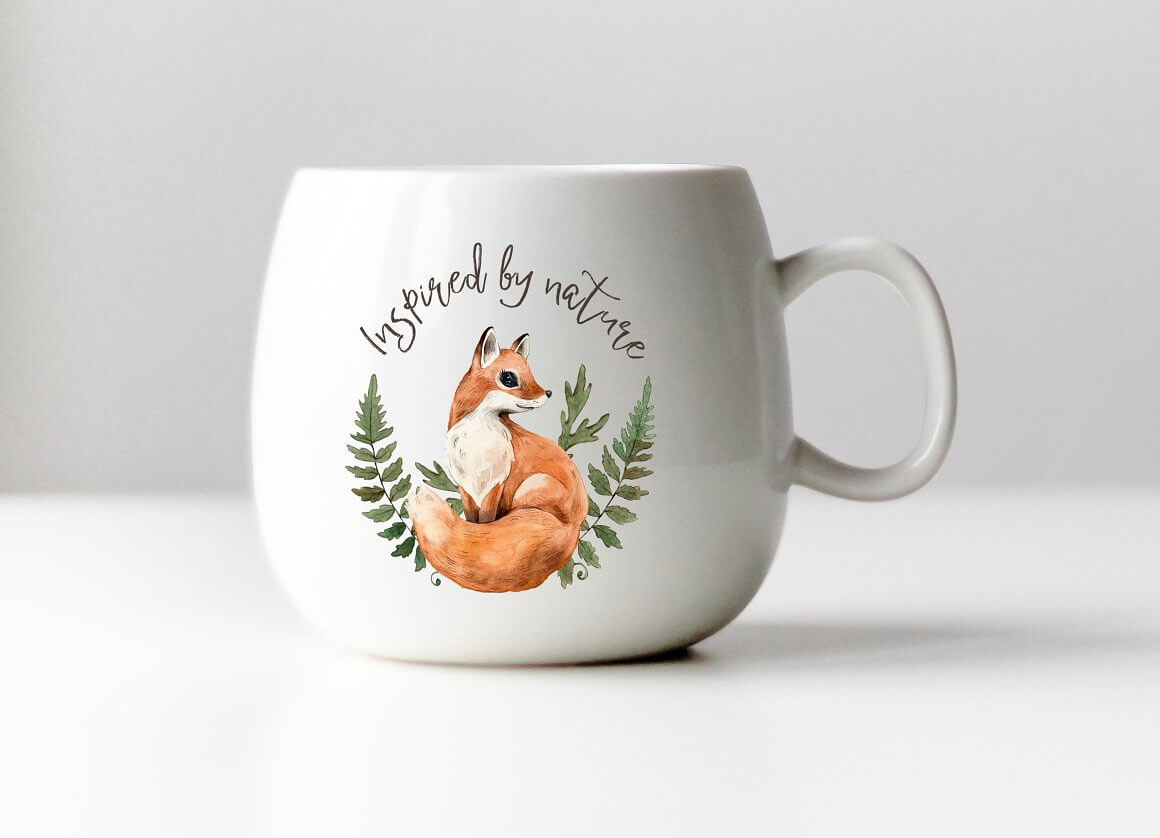 Cup with a pattern of a fox and a fern and with the inscription Inspired by nature.