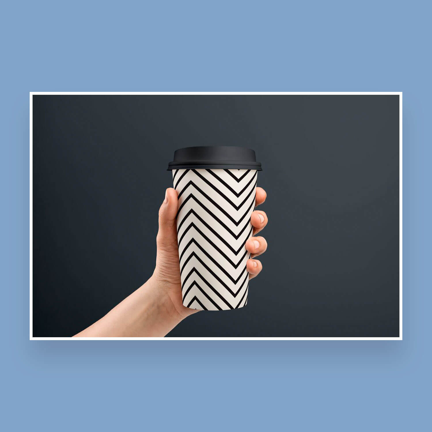 Disposable glass with geometric seamless patterns in black and white light.