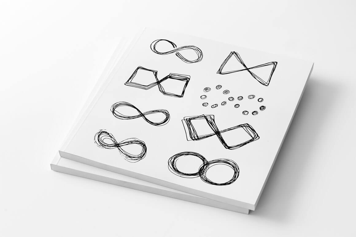 Notebooks with infinity drawings on white.
