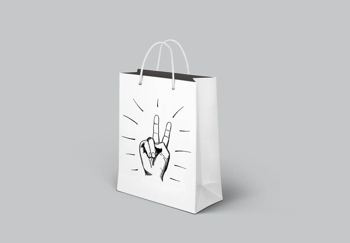 Pis sign drawing on a white paper bag, gray background.