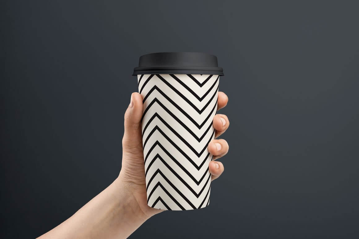 Zigzag coffee cup design on a gray background.