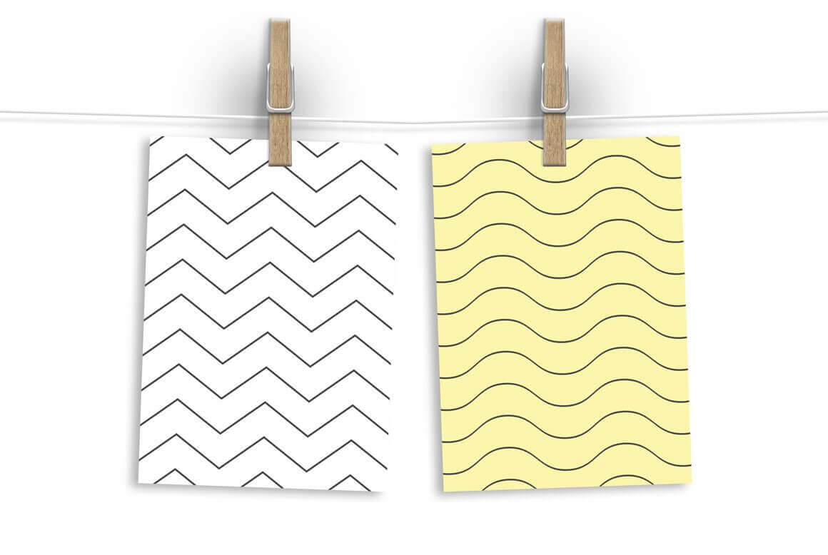 One white sheet with black zigzags, and a yellow sheet with wavy lines.