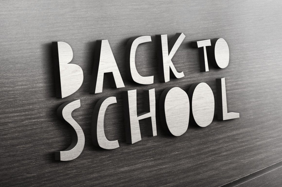 Embossed inscription on a wooden background: Back to School.