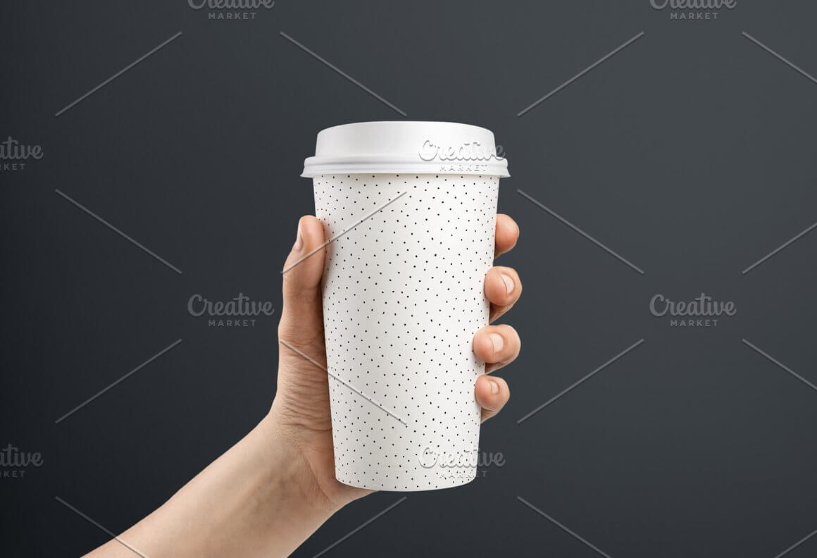 White coffee cup with small black dot design.
