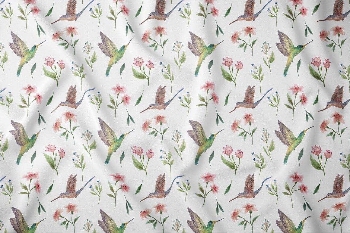 White fabric with watercolor painted hummingbirds and flowers.