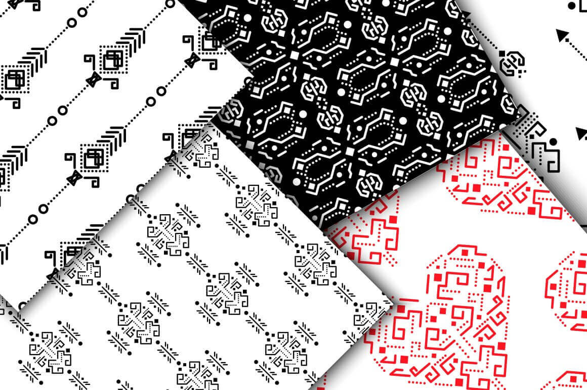 Ethnic embroidered patterns close-up on a white and black background.