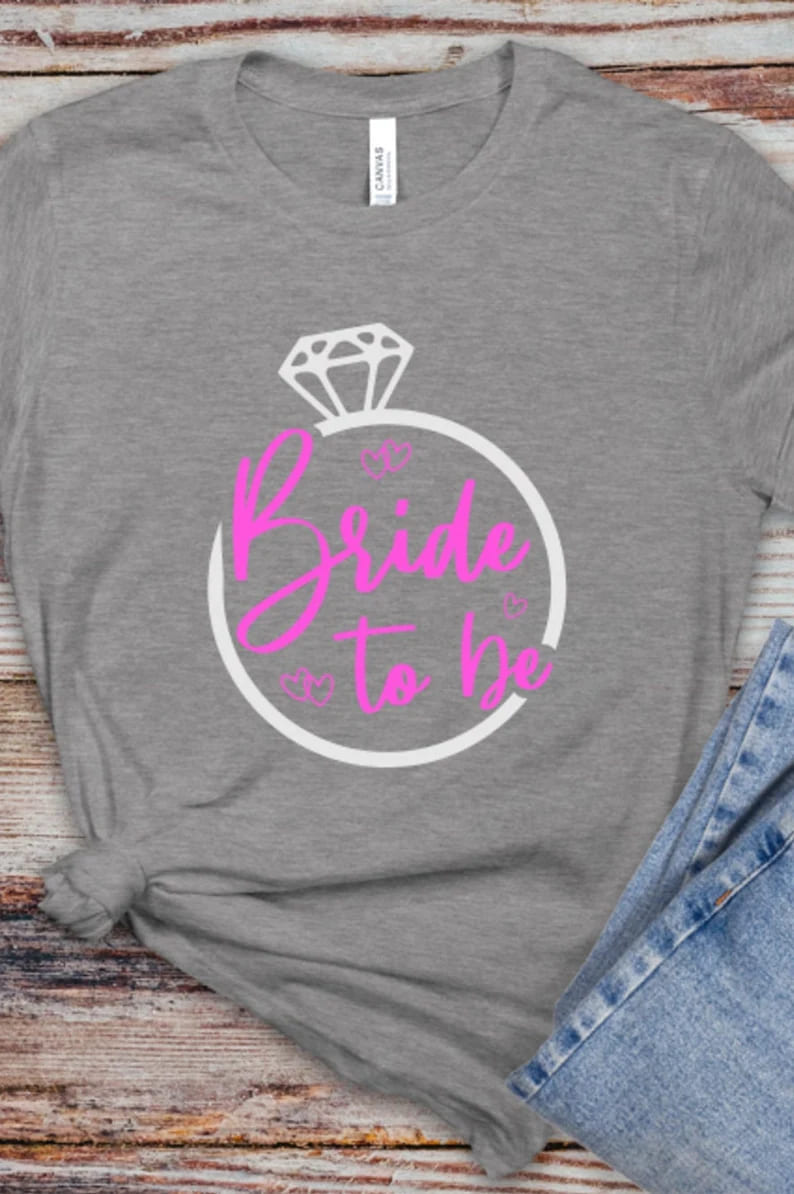 bride to be svg png, pink design on grey t-shirt mockup.