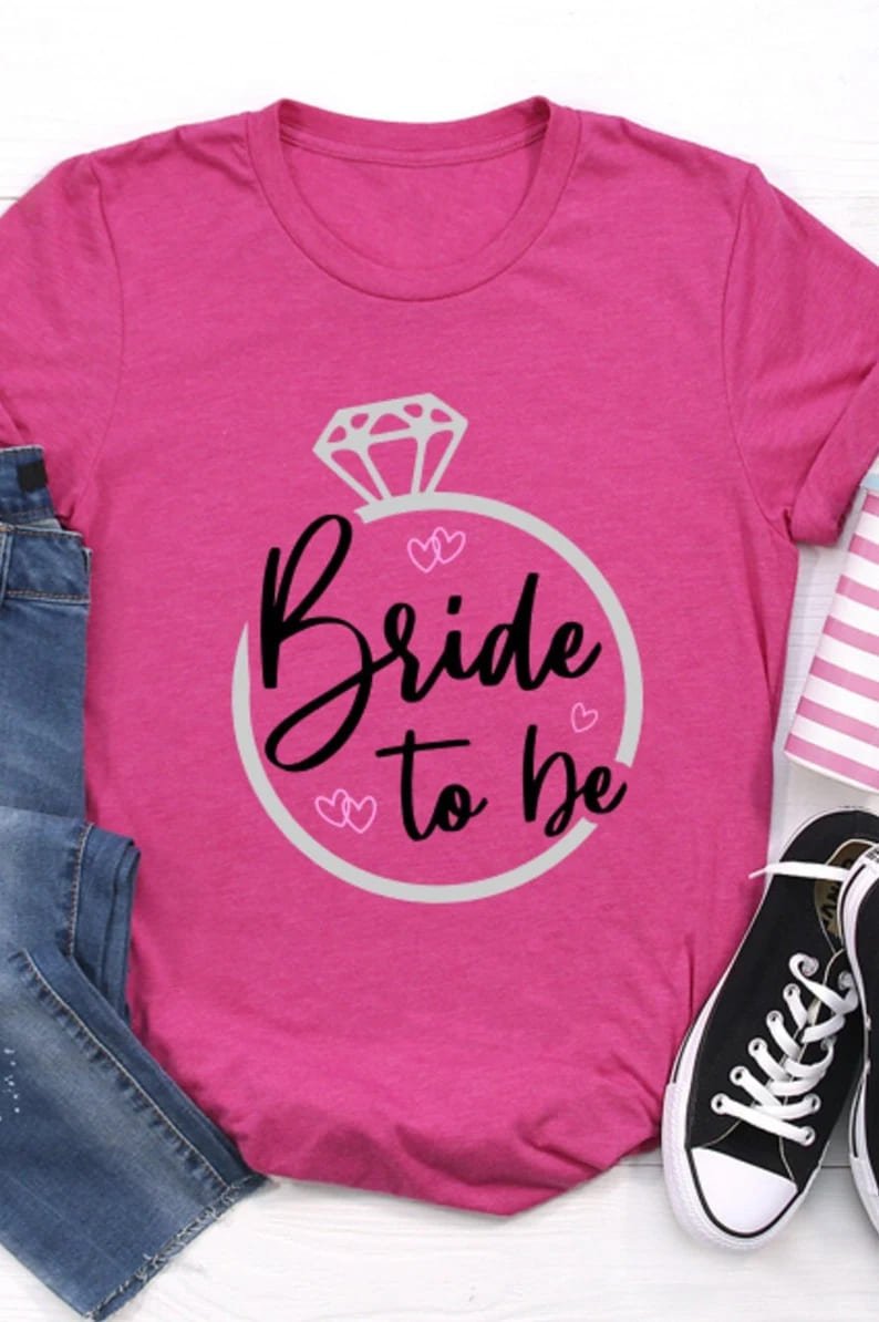 bride to be svg png, dark design on pink t-shirt mockup.