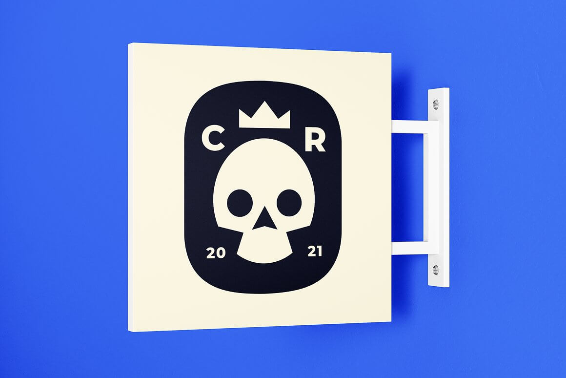 On a blue background there is a screwed white object on which there is a black badge with an image of a white skull.