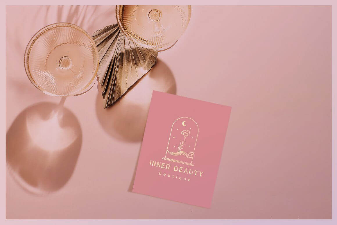Pink business card with inscription Inner beauty boutique.