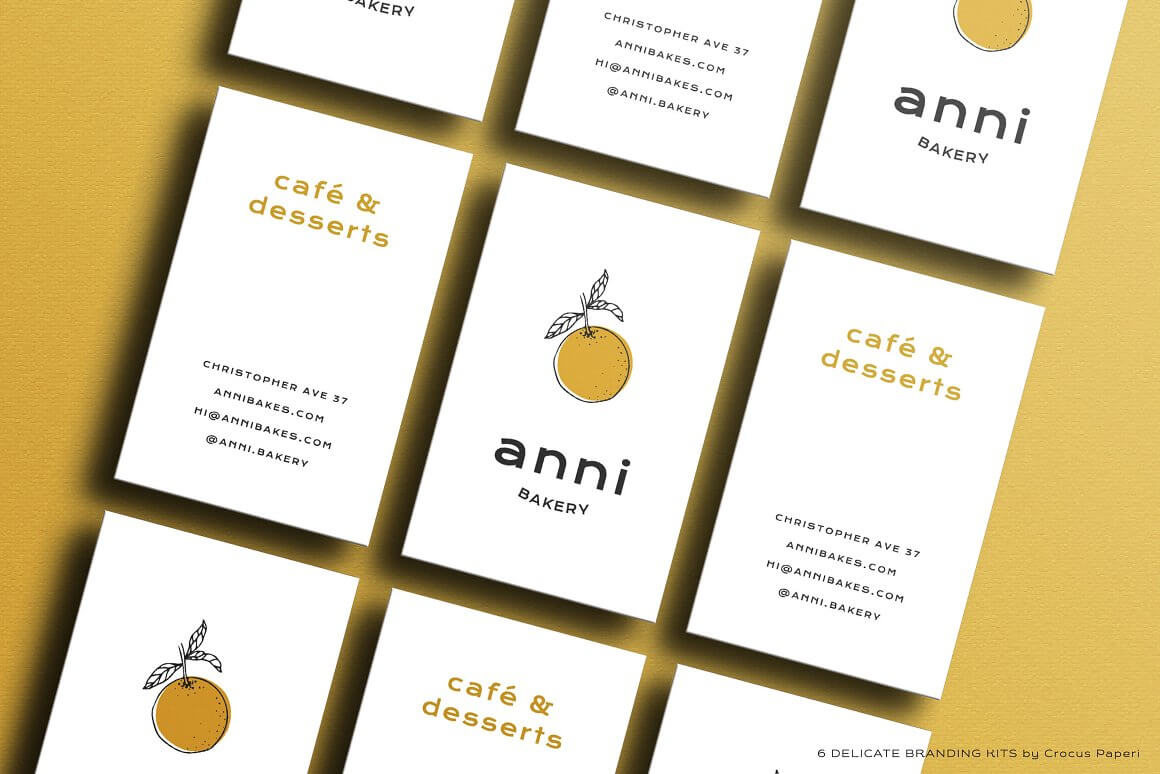 Anni Bakes cafe business cards on a lemon background.
