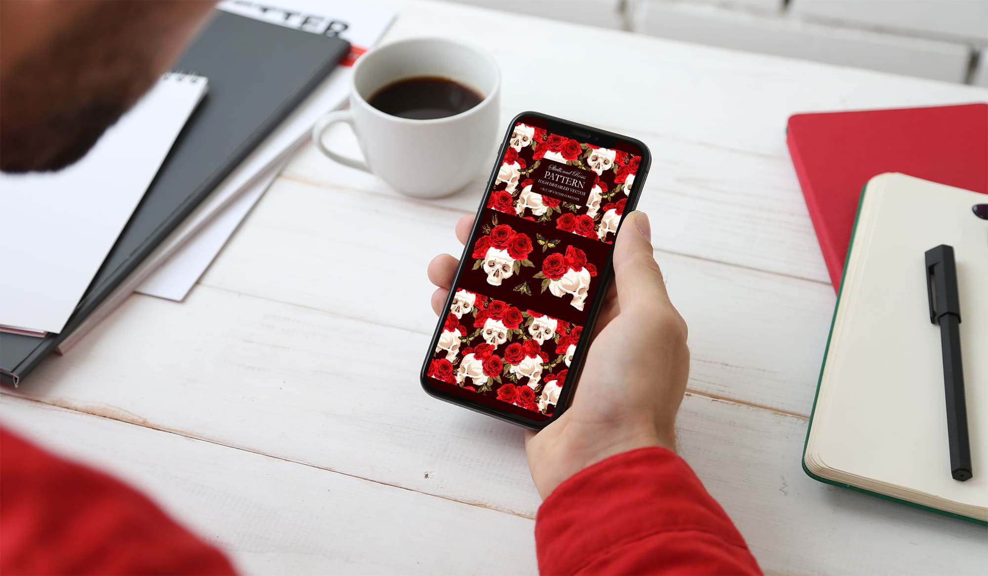 pattern with skulls and roses phone mockup.