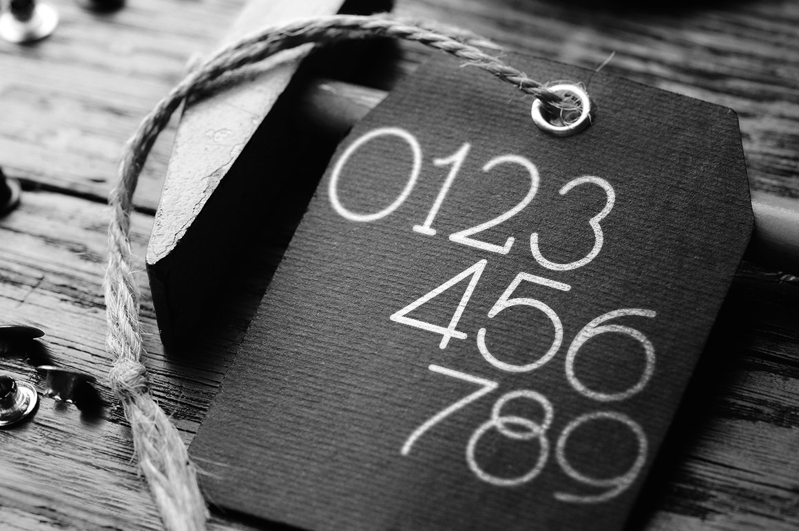 Font numbers on a black and white picture.