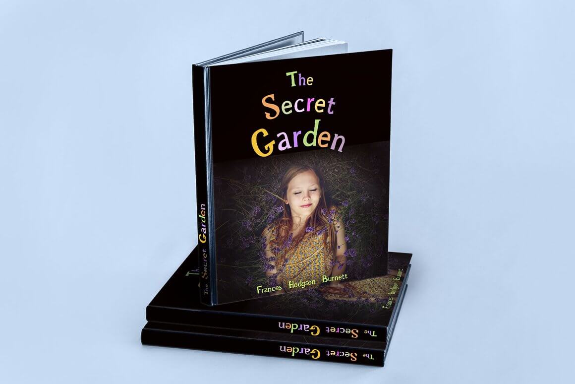 A book with a dark palette and the inscription secret garden.