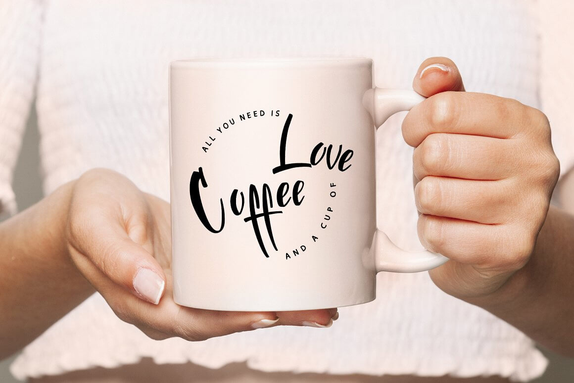 Inscription on the white cup "All you need is Coffee and a cup of Love".