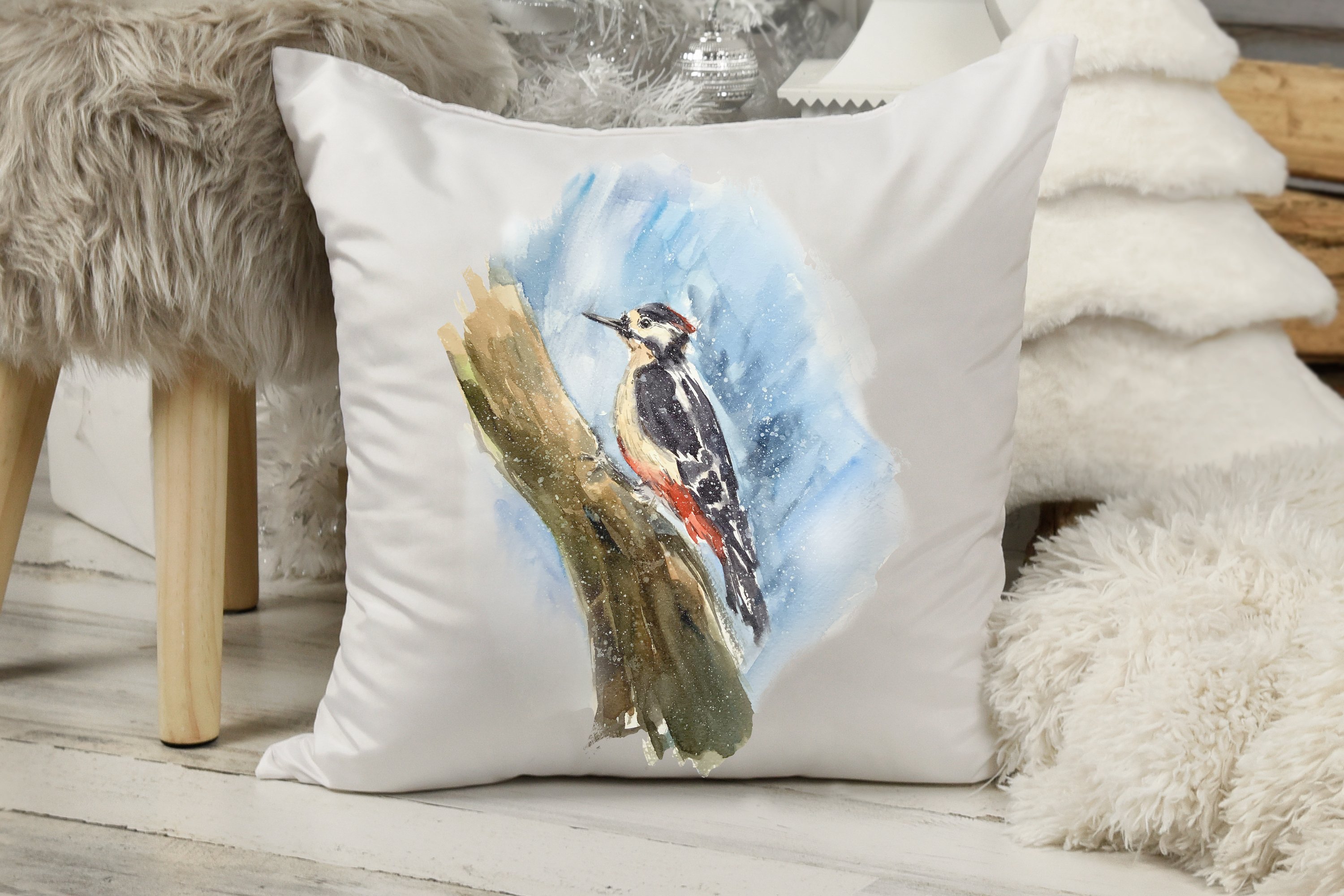 Pillow print with woodpecker on wood.