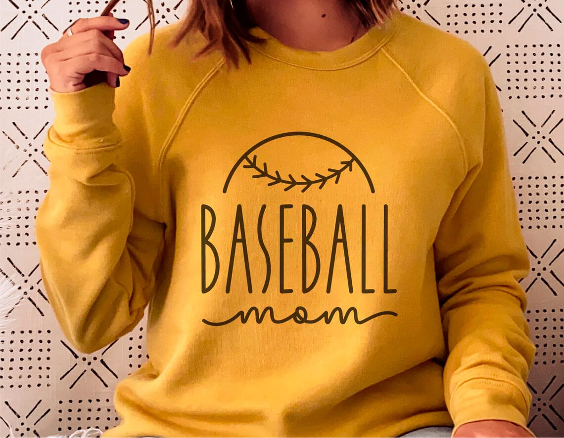 A girl in a baseball yellow sweatshirt.