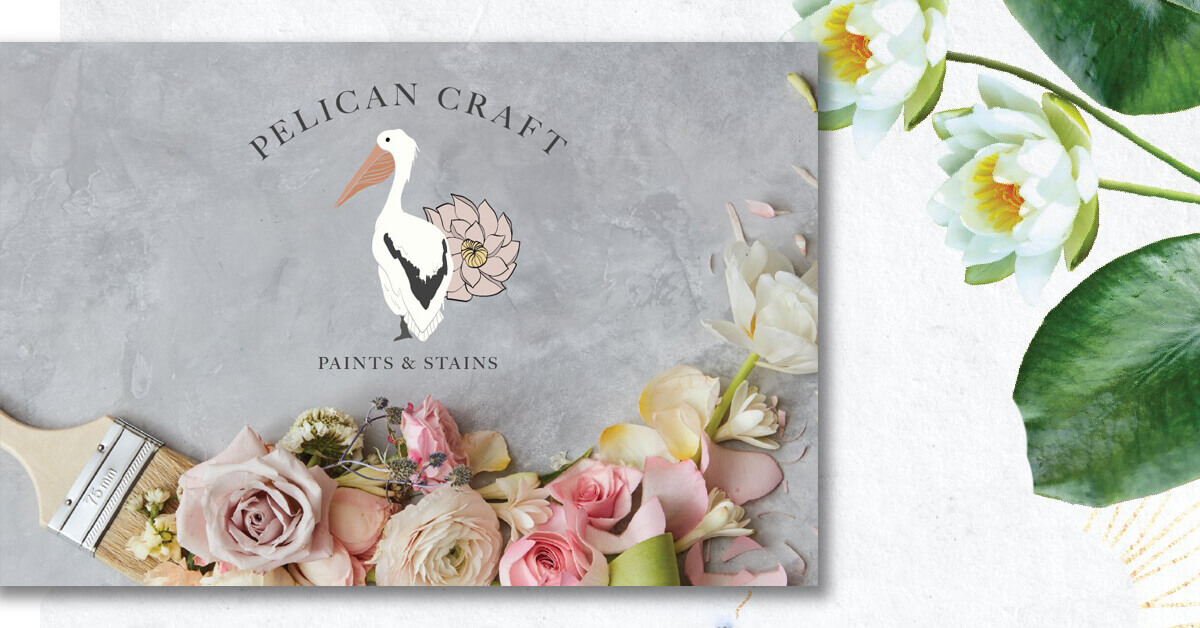 A whimsical pelican on a gray painting with pink flowers.