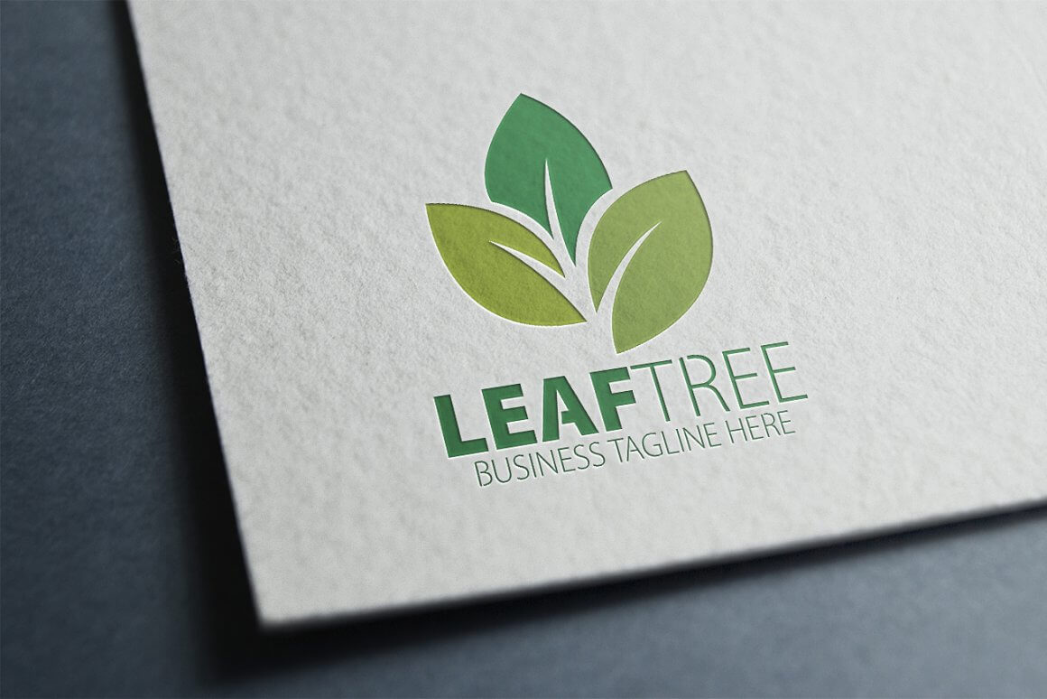 Green leaf tree logo on a gray leaf.