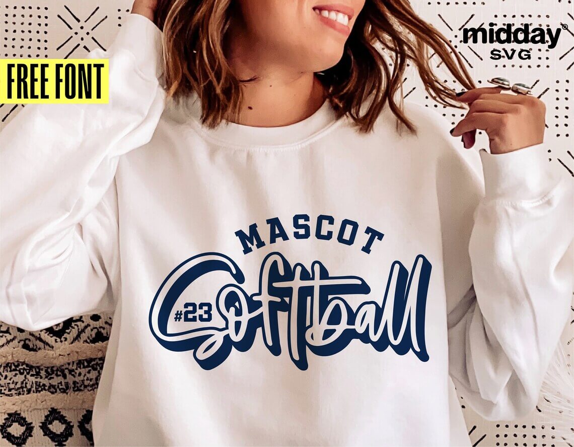 A girl in a white sweatshirt with a Softball logo on the chest.